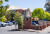 Burnside War Memorial Hospital Inc, a well-maintained brick building, is set amid green trees with convenient parking on a sunny day.